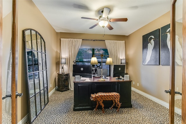 office area featuring baseboards, a ceiling fan, and french doors