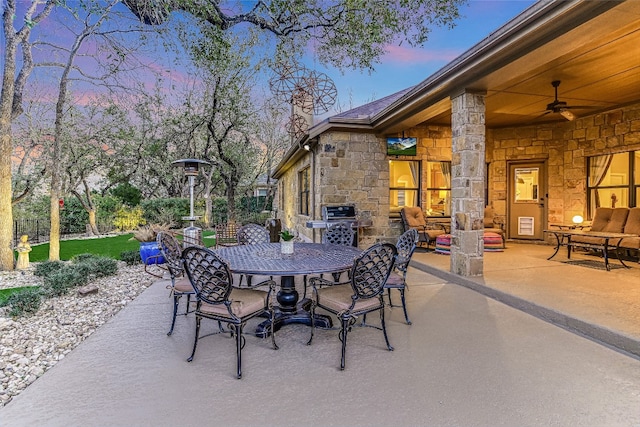 view of patio with a ceiling fan and outdoor dining space