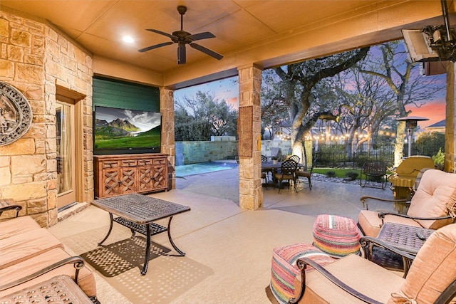 view of patio / terrace with ceiling fan, fence, and outdoor dining area