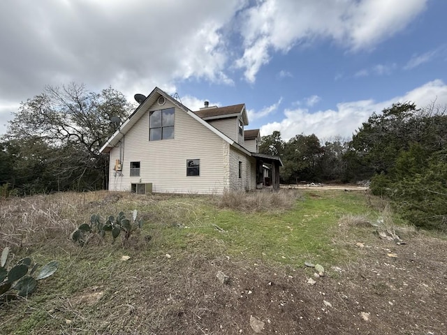 view of side of home with cooling unit