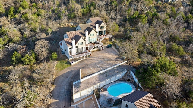 birds eye view of property with a view of trees