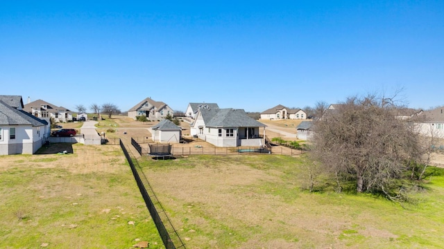 view of yard featuring a fenced backyard and a residential view