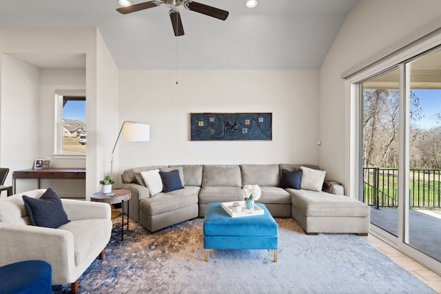 living room featuring a ceiling fan, recessed lighting, vaulted ceiling, and wood finished floors