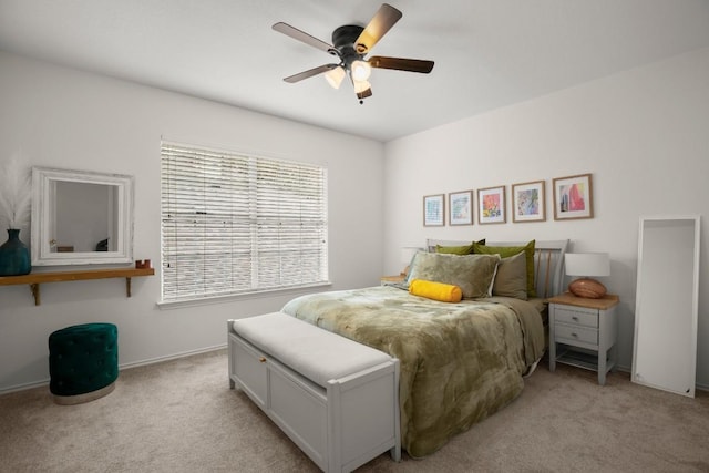 bedroom featuring light carpet and ceiling fan