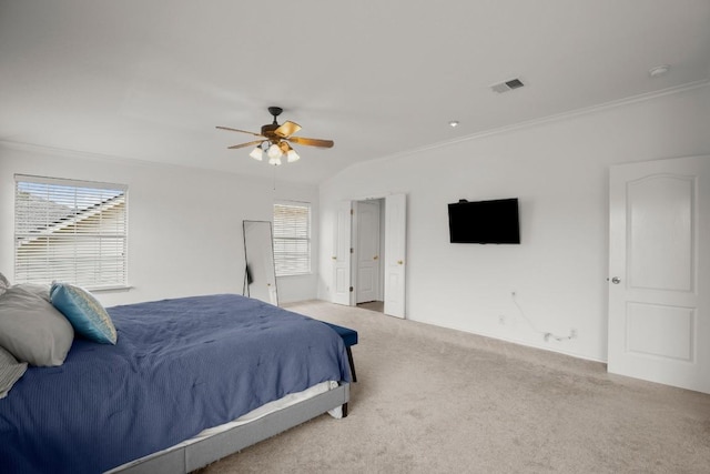 bedroom featuring crown molding, visible vents, ceiling fan, and carpet flooring