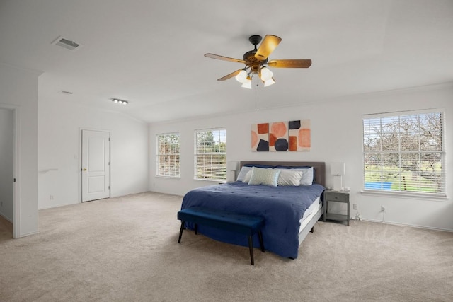 carpeted bedroom featuring ceiling fan, visible vents, and baseboards