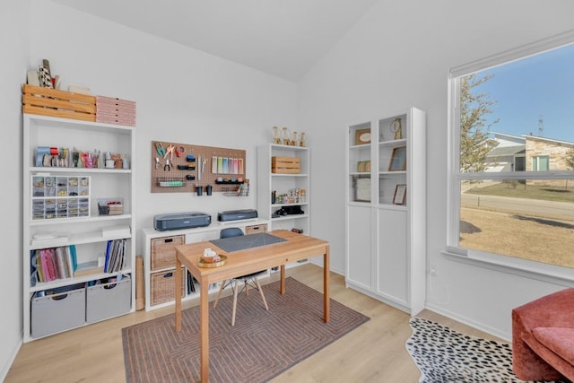 office area with lofted ceiling and light wood-type flooring