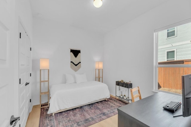 bedroom with wood finished floors