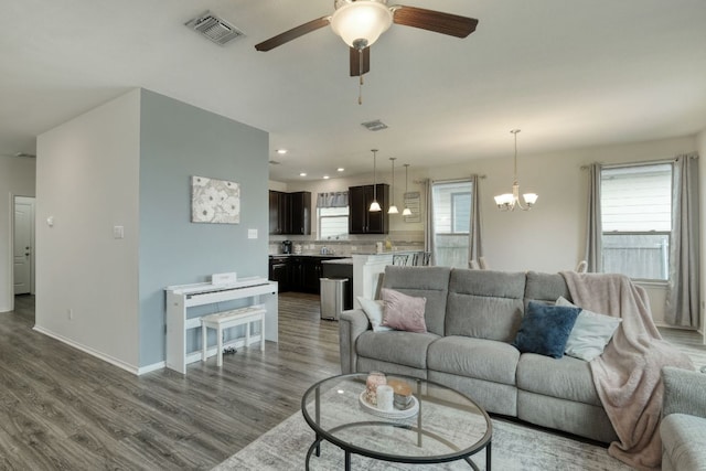 13505 Abraham Lincoln St, Manor, TX 78653 - living room with dark wood-style flooring, ceiling fan, healthy amount of natural light, a chandelier, and recessed lighting