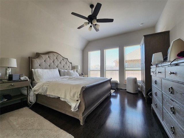 bedroom featuring vaulted ceiling, ceiling fan, and dark wood-style flooring