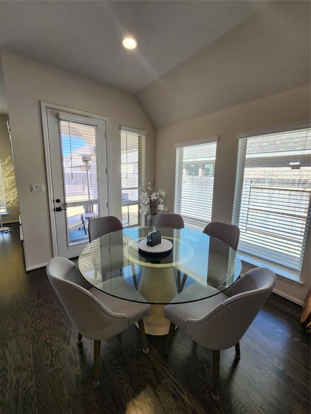 dining room with recessed lighting, lofted ceiling, and wood finished floors