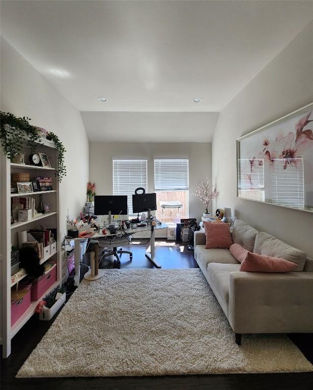 living area featuring lofted ceiling