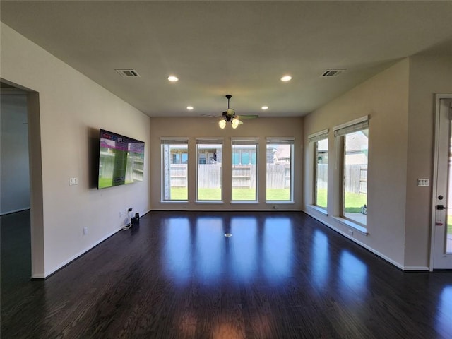 522 Jefferson Dr, Kyle, TX 78640 - unfurnished room with dark wood-style floors, ceiling fan, healthy amount of natural light, and recessed lighting
