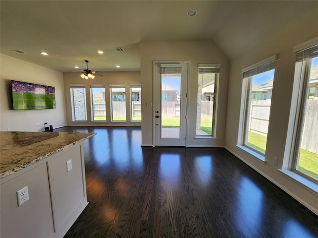 522 Jefferson Dr, Kyle, TX 78640 - kitchen with dark wood-style floors, a ceiling fan, recessed lighting, light stone countertops, and white cabinets