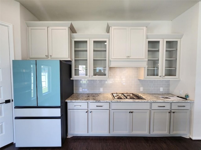 522 Jefferson Dr, Kyle, TX 78640 - kitchen featuring white fridge, stainless steel gas stovetop, tasteful backsplash, and light stone counters