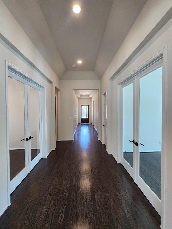 522 Jefferson Dr, Kyle, TX 78640 - corridor featuring french doors, vaulted ceiling, dark wood-type flooring, and recessed lighting