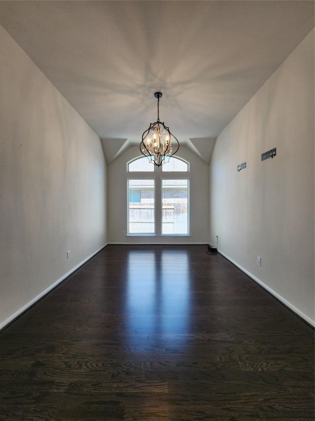 522 Jefferson Dr, Kyle, TX 78640 - unfurnished room with a chandelier, lofted ceiling, and dark wood-type flooring