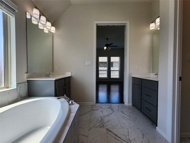 522 Jefferson Dr, Kyle, TX 78640 - bathroom featuring marble finish floors, a bath, vanity, a ceiling fan, and lofted ceiling