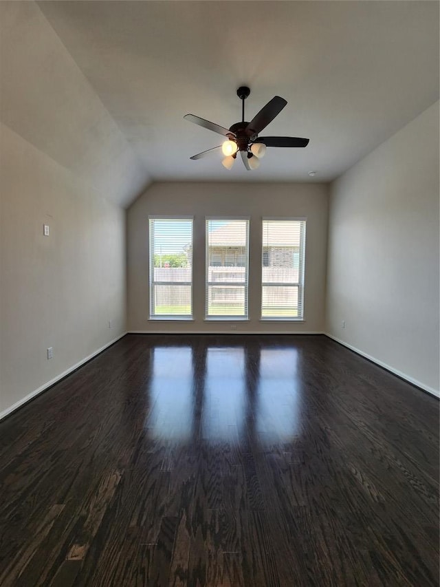 522 Jefferson Dr, Kyle, TX 78640 - unfurnished room featuring dark wood finished floors, ceiling fan, and vaulted ceiling