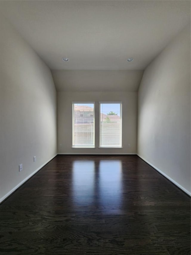 522 Jefferson Dr, Kyle, TX 78640 - unfurnished room with lofted ceiling, recessed lighting, and dark wood-style flooring