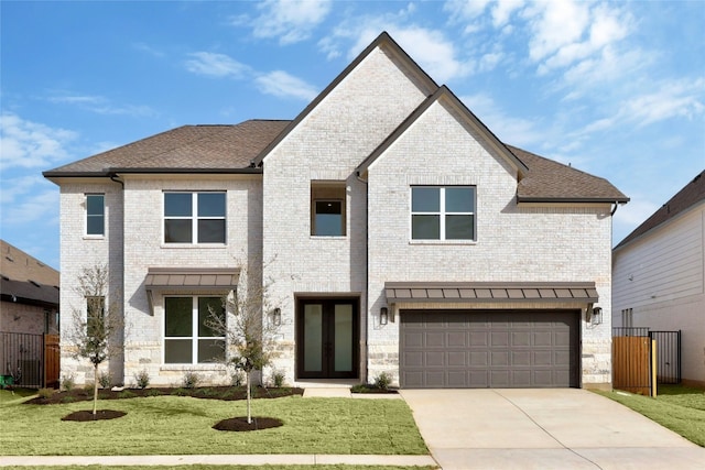 216 Echo Pass, Liberty Hill, TX 78642 - view of front of home featuring concrete driveway, an attached garage, brick siding, and roof with shingles