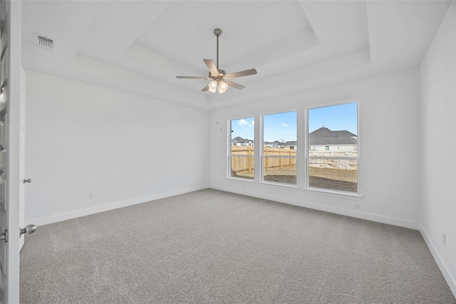 216 Echo Pass, Liberty Hill, TX 78642 - carpeted spare room with a raised ceiling, a ceiling fan, and baseboards