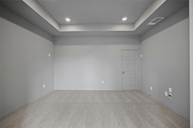 216 Echo Pass, Liberty Hill, TX 78642 - unfurnished room featuring carpet flooring, a tray ceiling, and recessed lighting