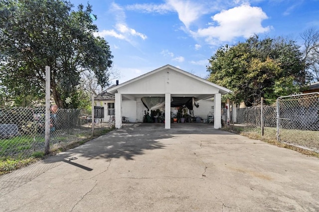 exterior space with driveway and fence