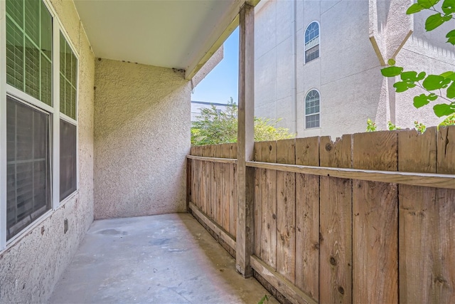 view of patio featuring fence