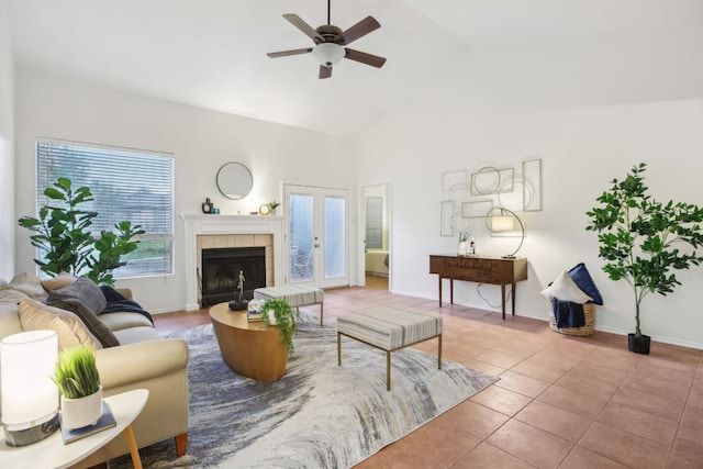 living room with a fireplace, baseboards, and tile patterned floors