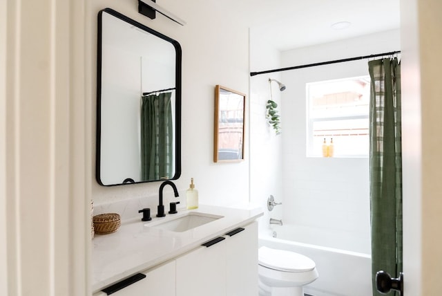 bathroom featuring vanity, shower / bath combination with curtain, and toilet