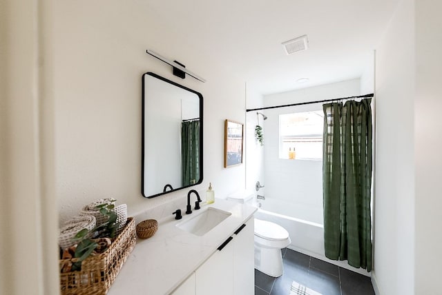 bathroom featuring toilet, visible vents, vanity, tile patterned floors, and shower / bath combo