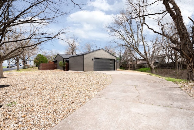 view of side of home featuring fence