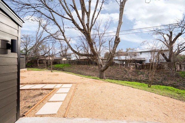 view of yard featuring a patio area and fence