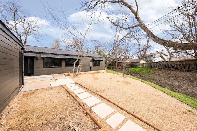 view of yard with a patio and fence