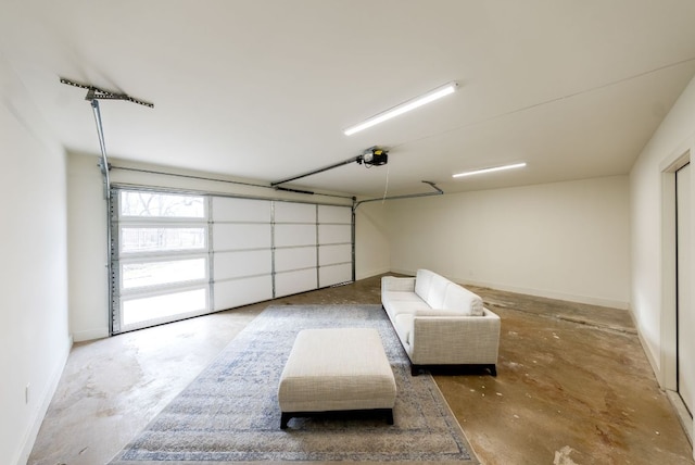 garage featuring baseboards and a garage door opener