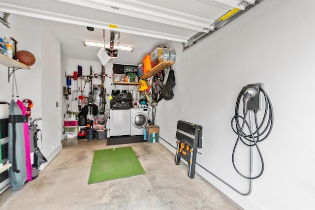 garage featuring a garage door opener and independent washer and dryer