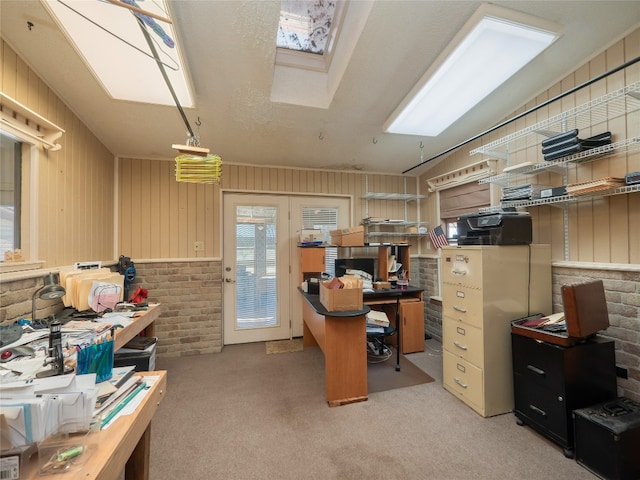 805 Wanta Hideaway, Spicewood, TX 78669 - carpeted home office featuring brick wall and a skylight