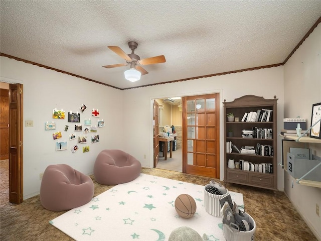 805 Wanta Hideaway, Spicewood, TX 78669 - rec room featuring carpet flooring, crown molding, ceiling fan, and a textured ceiling