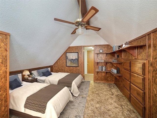 805 Wanta Hideaway, Spicewood, TX 78669 - bedroom with a textured ceiling, vaulted ceiling, and carpet floors