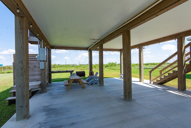 view of patio / terrace featuring stairs