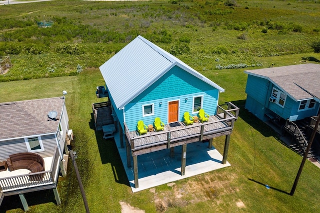 back of house with a patio area and a wooden deck