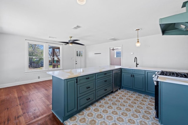 2702 S 2nd St Unit 1 & 2, Austin, TX 78704 - kitchen featuring dishwasher, range hood, a peninsula, and light countertops