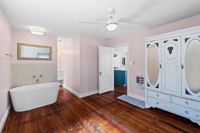 2702 S 2nd St Unit 1 & 2, Austin, TX 78704 - full bath featuring heating unit, a freestanding bath, hardwood / wood-style floors, and ceiling fan