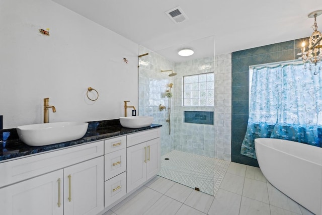 2702 S 2nd St Unit 1 & 2, Austin, TX 78704 - full bath featuring walk in shower, a freestanding bath, tile patterned floors, and double vanity