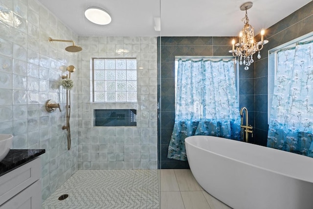 2702 S 2nd St Unit 1 & 2, Austin, TX 78704 - bathroom with a chandelier, a freestanding tub, tile walls, a walk in shower, and vanity
