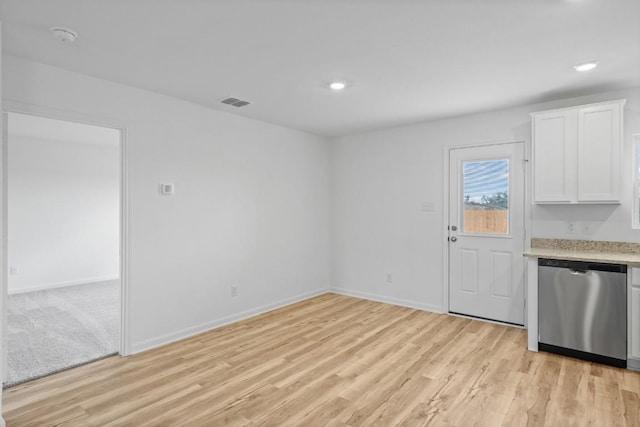 unfurnished dining area with light wood finished floors, visible vents, baseboards, and recessed lighting