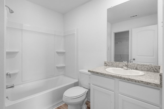 full bath with toilet, wood finished floors, vanity, visible vents, and  shower combination