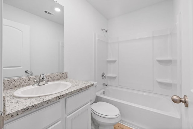 full bath with visible vents, vanity, toilet, and bathing tub / shower combination