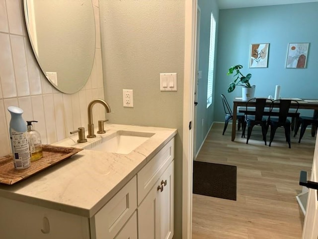 bathroom featuring vanity and wood finished floors